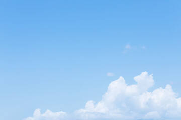 Blue sky background and white clouds soft focus, and copy space horizontal shape.