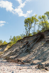 Steep coast of Baltic sea in Jurkalne on a sunny day in May in Latvia