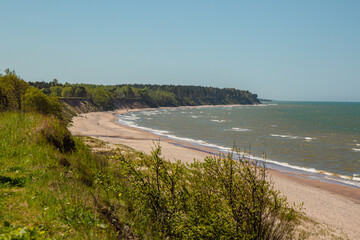 Steep coast of Baltic sea in Jurkalne on a sunny day in May in Latvia