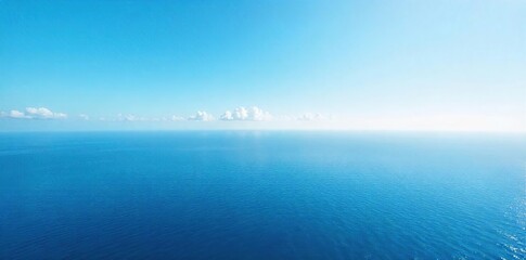Obraz premium Vast, unbroken expanse of calm ocean meeting the horizon under a clear sky Perfect for travel, serenity, and nature themes A breathtaking view of the endless blue , vacation, vast, blue