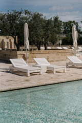 swimming pool in the luxury resort with olive trees