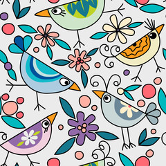 Seamless pattern with funny colorful birds, surrounded by pink flowers and green leaves on white background. Could be used as texture, print, wallpaper, card. 