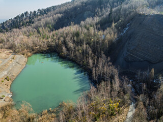 Aerial drone view of Quarry in Kozy an inactive quarry of Lgocka sandstones located on the slope of Chrobacza meadow, within the Magurka Wilkowicka group in Kozy, Polish Beskids.