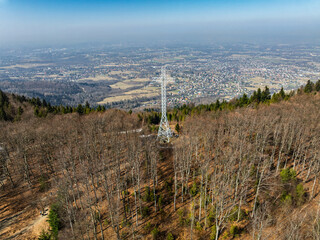 Aerial drone view of beskid mountains in spring. Chrobacz Meadow peak in the Magurka Wilkowicka Group in the Little Beskids. Cross on a mountaintop in the Beskids..