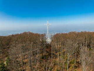 Aerial drone view of beskid mountains in spring. Chrobacz Meadow peak in the Magurka Wilkowicka Group in the Little Beskids. Cross on a mountaintop in the Beskids..
