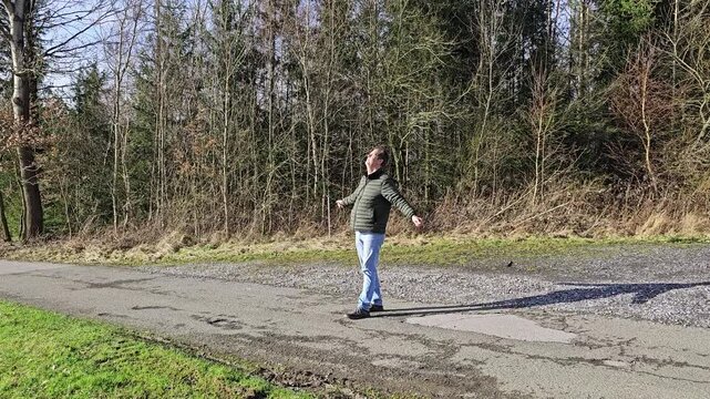 Meditation outdoors: Person finds peace and harmony in the forest environment &ndash; ​​stress reduction and mindfulness