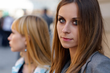 Portrait of Two Women in Urban Setting With Serious Expressions..