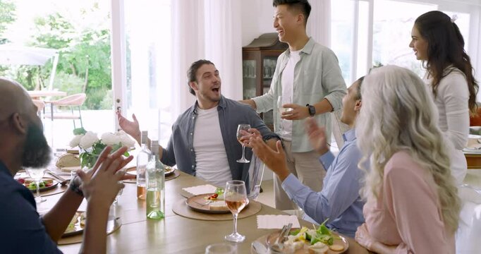 Finishing speech, Diverse friends clapping, standing, raising wine glasses for toast dining table