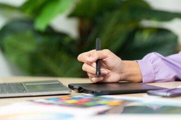 Graphic Design Creation. Designer sketching ideas on tablet with stylus.