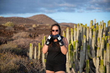 active, activity, adult, athlete, authentic, beauty, box, Boxer, boxing, cacti, cactus, casual, caucasian, exercise, face, female, fight, fit, fitness, focus, green, health, healthy, hit, horizontal, 