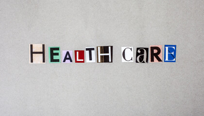 letters spelling Health Care in magazine cut outs