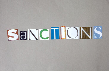 The word "sanctions" is written in a jumbled, torn-up style