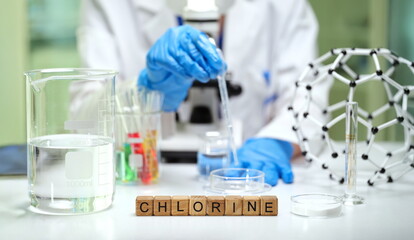 Fototapeta premium A scientist working with chlorine in a laboratory setting, showcasing chemical reactions and analysis.