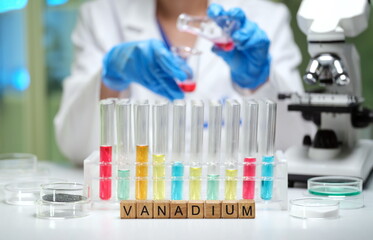 Fototapeta premium The scene in a laboratory features an exciting chemical experiment with many colorful test tubes and vanadium elements