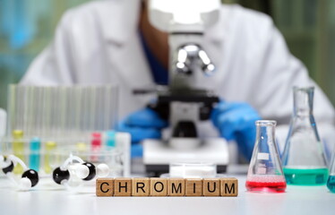 In the lab, we explore Chromium with a microscope and colorful beakers of various chemical solutions