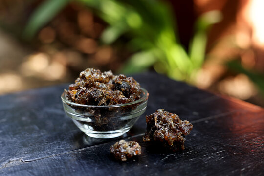 Indian Pooja Samagri  called Gugal or Gugul isolated on dark Natural background 