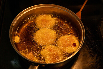 Plantains frying in a pan