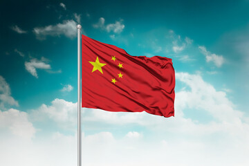 High-resolution stock image of a gently billowing China national flag mounted on a modern flagpole...