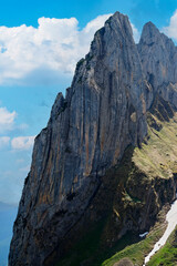 Spectacular mountain peaks rise against a clear blue sky in a breathtaking landscape view