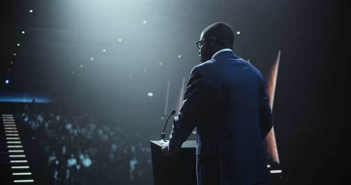 Respected Young African Professor Speaking at a Medical Seminar to a Group of International Research and Development Professionals and Scientists. Doctor Making a Presentation About a New Discovery