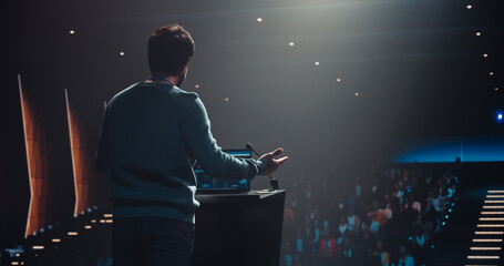 South Asian Personal Growth Keynote Speaker Using Laptop and Delivering a Motivational Speech on...