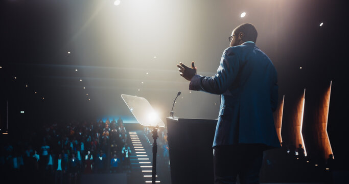 Visionary African Leader Speaking at a Global Economic Strategies at International Business Conference. Public Speaker Sharing Professional Knowledge and Leadership Insights to the Guests in the Room