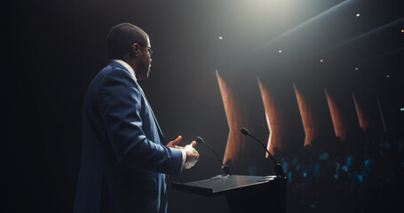 Portrait of an Excited Black Entrepreneur Sharing an Inspiring Talk on Technology and Leadership at...
