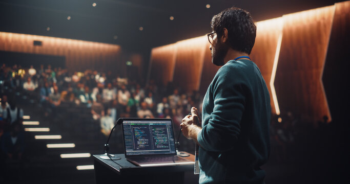 Portrait of an Indian Speaker Coaching Specialists During a Presentation at a Business and Technology Conference. Businessman Showing a Futuristic Tech Presentation About AI and LLM Systems