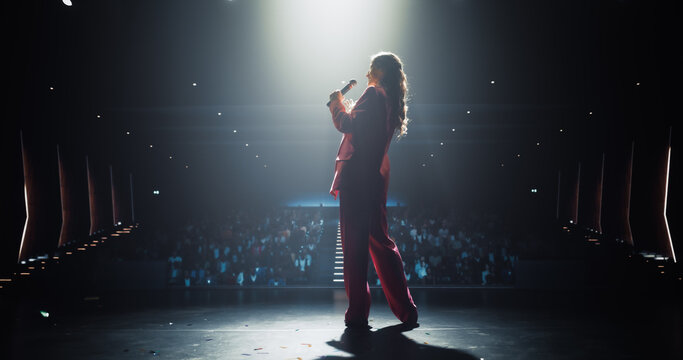Female Making a Life Coaching Session for People Wishing to Have a Healthy and Successful Personal and Professional Life. Lifestyle Specialist Making a Presentation to a Big Audience