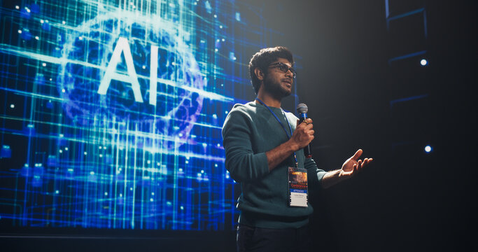Portrait of an Indian Speaker Coaching Specialists During a Presentation at a Business and Technology Conference. Businessman Showing a Futuristic Tech Presentation About AI and LLM Systems