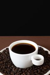 White Cup of Black Coffee with Roasted Coffee Beans on Minimal Background for Advertising Use