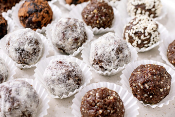 Assorted raw vegan balls Truffles in Paper Cups