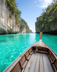 Long tail boat floating in turquoise lagoon surrounded by limestone cliffs in Thailand, peaceful tropical setting