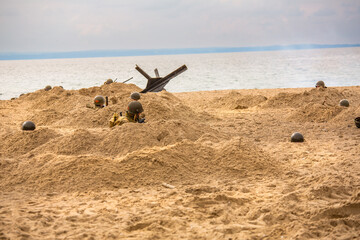 Historical reconstruction. An American infantry soldiers from the World War II  fight on the beach....
