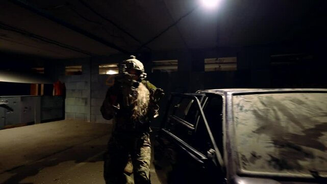 A group of fighters with weapons moves around an abandoned building, creating an atmosphere of danger.