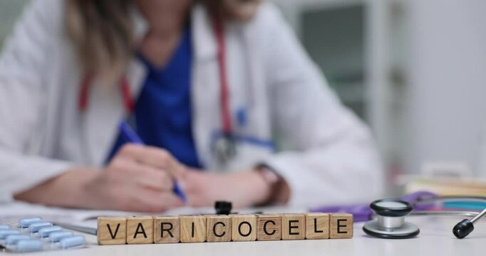 Female physician writes prescription for treatment near wooden cubes with Varicocele on desk. Importance of addressing male reproductive health