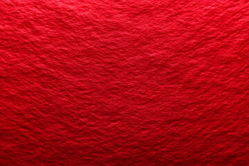 A vibrant red textured background that adds depth and warmth to any design project. Perfect for use in artistic and creative applications.