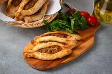 Dishes from traditional Turkish cuisine; Mini pita with minced meat - Turkish name; Kiymali mini...