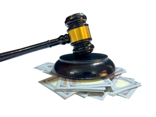 A gavel with American dollars scattered under it, corruption concept. Bribery, corrupt justice