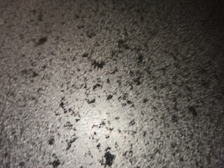Macro shot showing used pan surface with heat marks and dark spots.