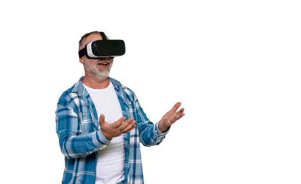 Senior man experiencing virtual reality in home environment while expressing excitement and engagement
