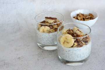 Chia Seed Pudding with Banana and Granola and walnut in Glass
