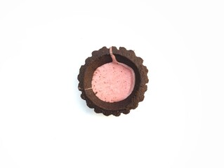 Chocolate puff pastry with strawberry jam isolated on white background, top view 