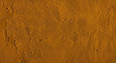 Textured Gold Wall with Peeling Paint and Cracks Illuminated by Warm Light Creating a Distressed Surface