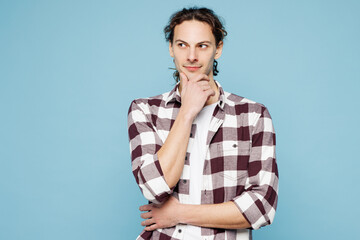 Young man he wear purple checkered shirt casual clothes put hand prop up on chin, lost in thought...
