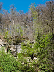 people scramble on the rocks in muellertal on sunny day in spring