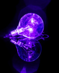 Glowing Glass Lightbulb with purple laser lighting it