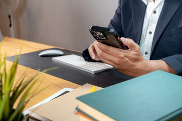 Close-up of a professional using a mobile phone — digital tools in corporate life