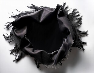 hole in black fabric with frayed edges on a white background