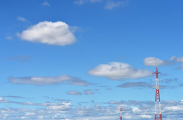 Obraz premium 青空にぽっかり浮かぶかわいらしい白い雲